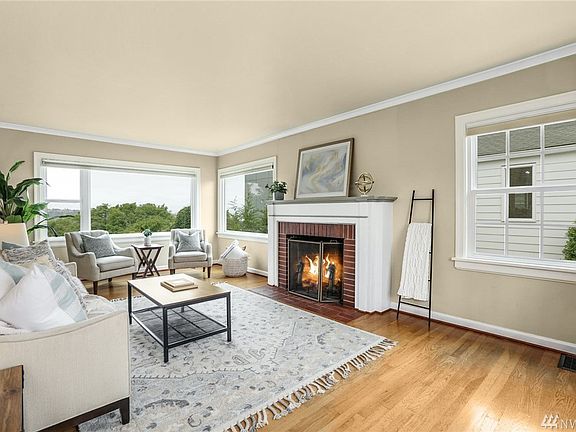 Inside you'll find a spacious floor plan with great flow and natural light. The gorgeous living room has a fireplace that is plumbed and ready for a gas insert.