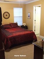 The master bedroom is highlighted by a double trey ceiling