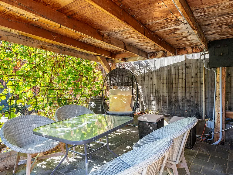 Shaded back patio dining area