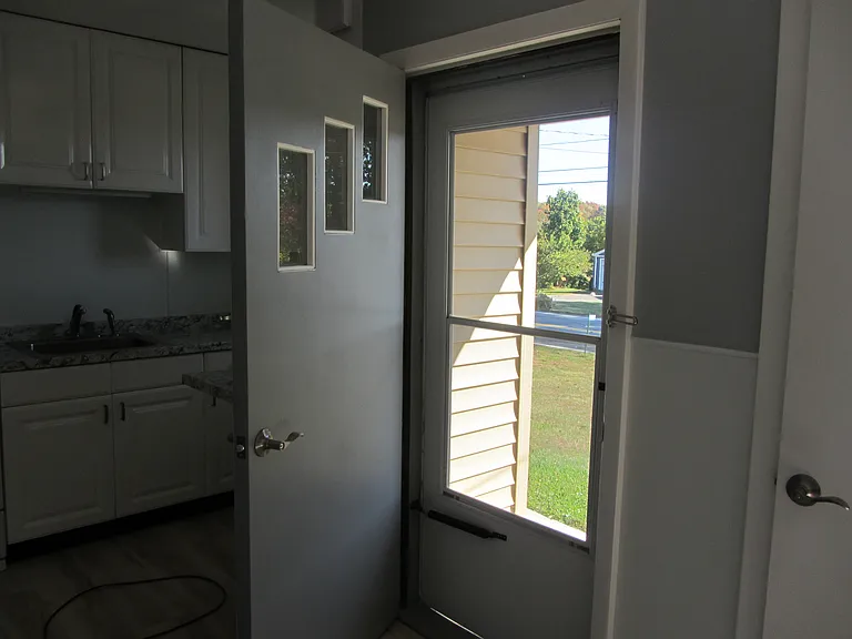 Front door with new screen door.