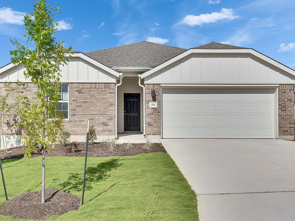 Elegant brick facade and pristine landscaping define this luxurious home in Blanton, Calumet.