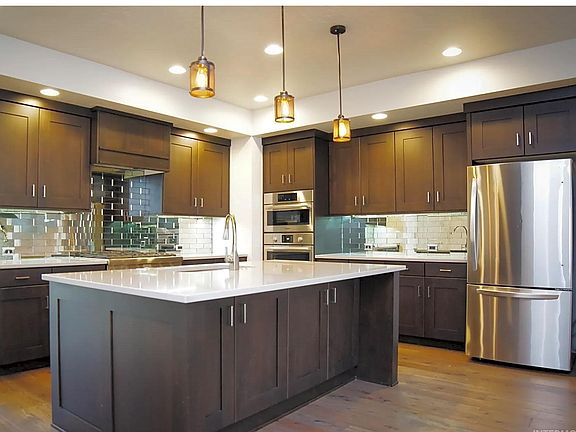 island with room for barstools. Refrigerator included