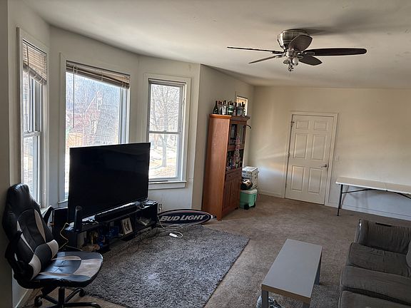 Another view of living room to front entryway door
