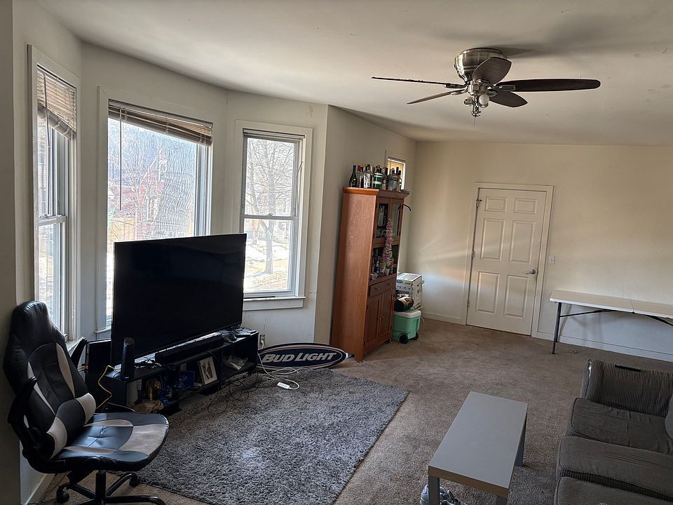 Another view of living room to front entryway door