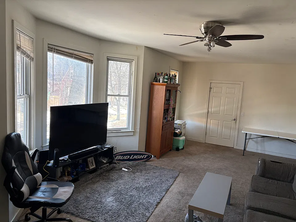 Another view of living room to front entryway door