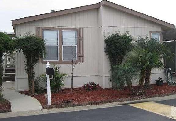 Newly installed covered carport creates privacy from neighboring home.