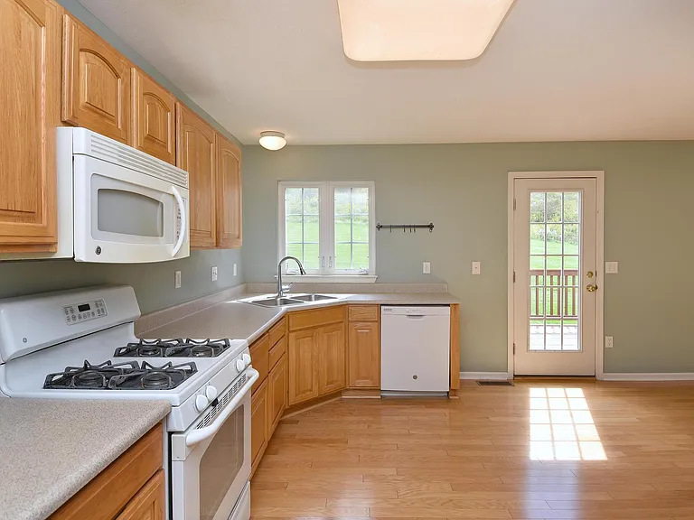The kitchen leads to the deck.
