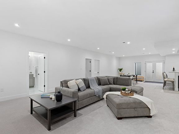 Sectional sofas, ottoman, and coffee table