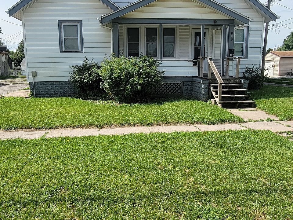 Driveway is on the left, right by the side door.
