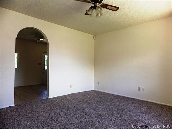 Upper living room with door to the kitchen.