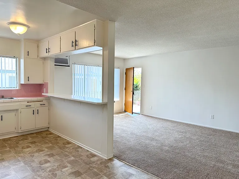 View from dining room and kitchen into livingroom