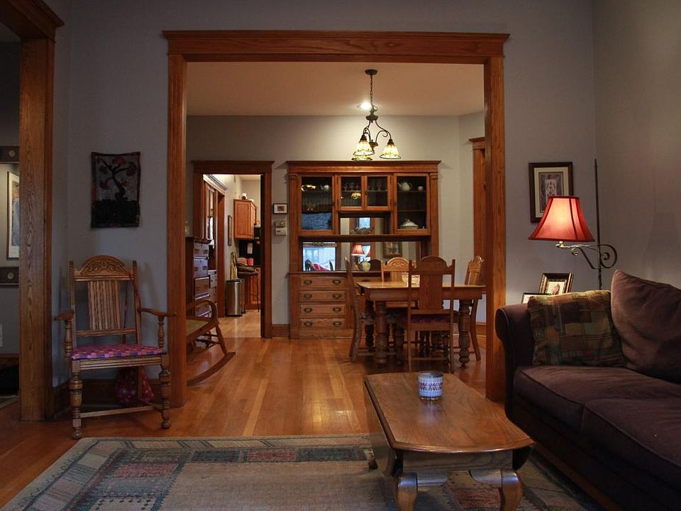 Charming craftsman-style living room and dining room with or