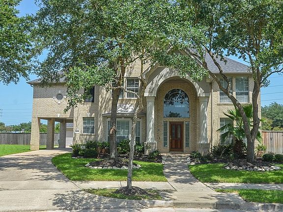 This lovely home is located at the end of a tree lined cul-de-sac.
