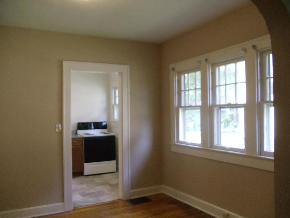 View looking towards back of home through dining room into t
