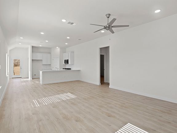 Living room in the Pecan II home plan by Trophy Signature Homes - REPRESENTATIVE PHOTO