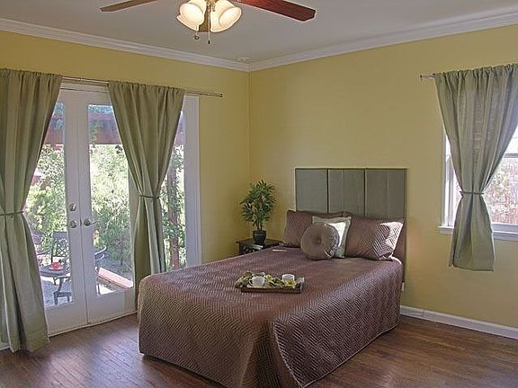 Bedroom with french doors to backyard.