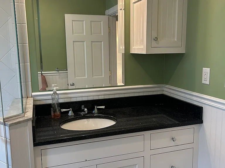 First sink to the right of the shower.
