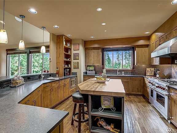 Incredible chef's kitchen. Slab granite, abundant cabinetry, superior stainless appliances, large walk-in pantry.