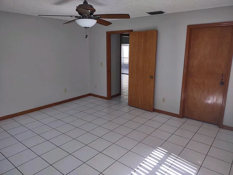 Main bedroom with walk-in closet view to the right