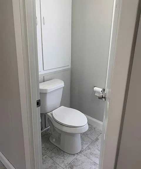 1/2 bath with storage cubboard