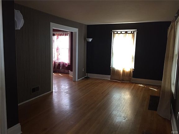 Beautiful Hardwoods as you enter into the Living Room and over into the Dining Room