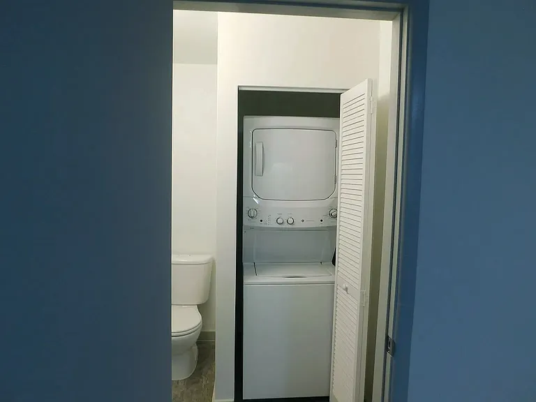 Second bedroom one-half bath with stack washer and dryer.