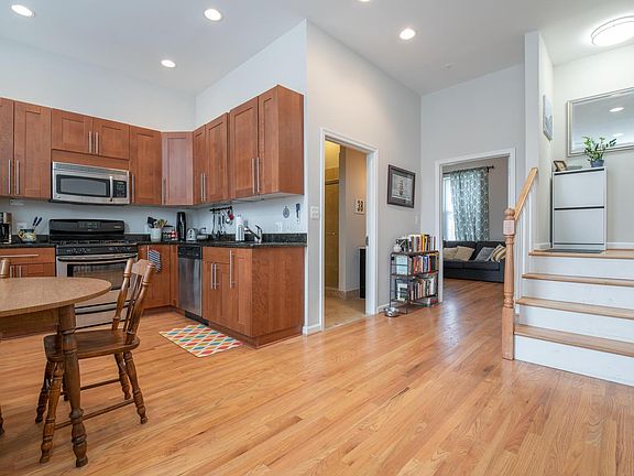 Kitchen & Stairs leading to 2nd bedroom