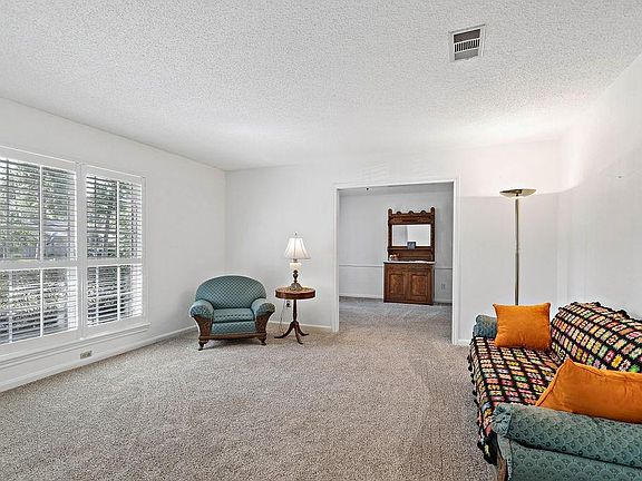 To the left of the entry is a formal living area. Nice space to entertain guests or read a book. Plantation shutters in this room as well.