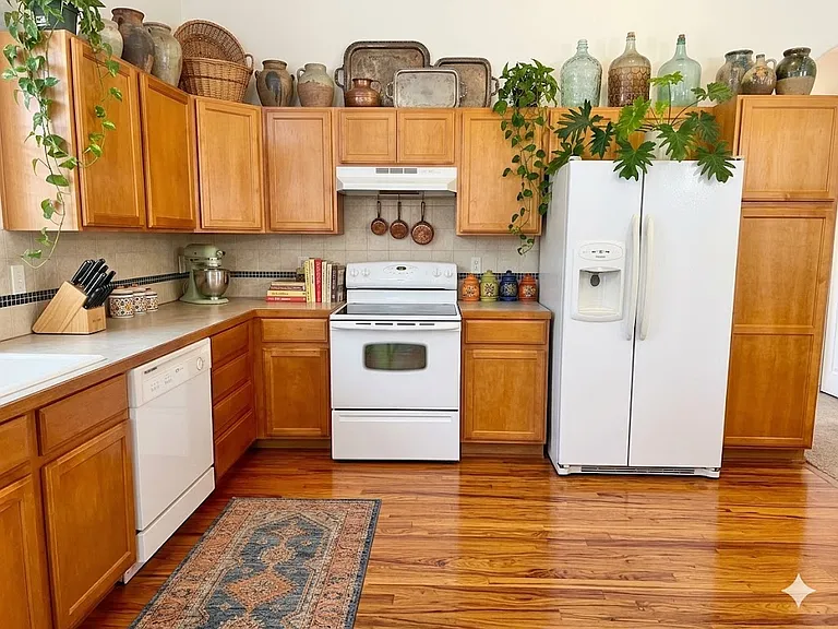 AI decorated view of kitchen. NOTE: House is unfurnished.