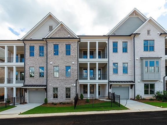 Stacked condos offer rare one-level living in Peachtree Corners, GA. Photos shown are of similar ho
