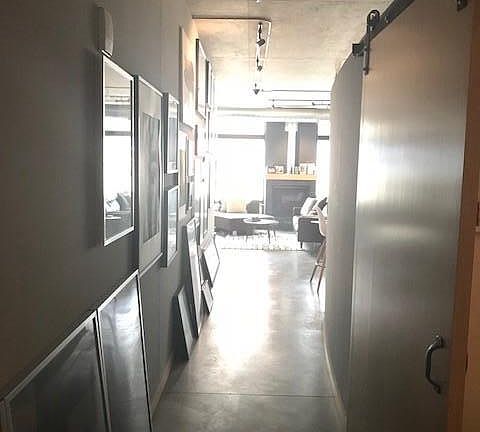 The barn door allows privacy to the bedroom while 10' ceilings make the apartment feel extra bright and open. There is a hall closet with lots of room for coats, shoes and extra storage.