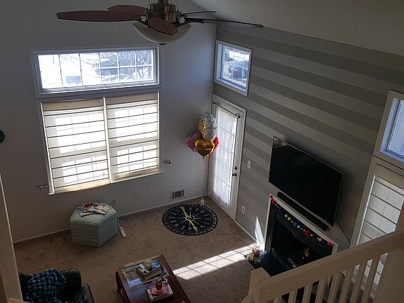 2 Story height ceiling Living Room with Fire place.