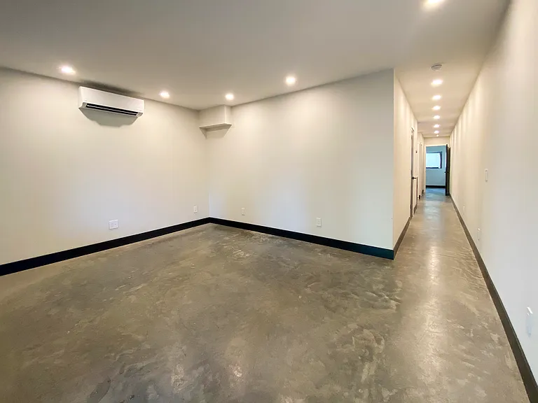 Main room with heated concrete floors (radiant heat) and split unit for heat and AC