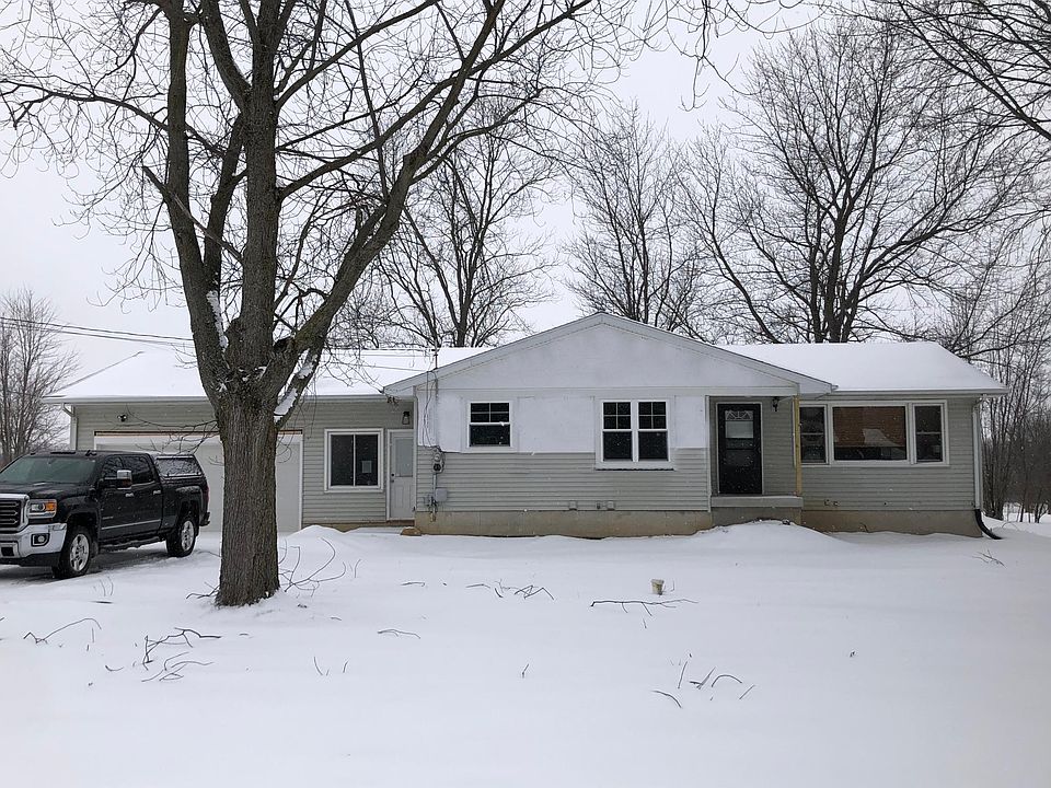Front of house. Siding around brand new windows will be finished soon!