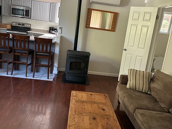 Living room w. pellet stove & 1/2 bath