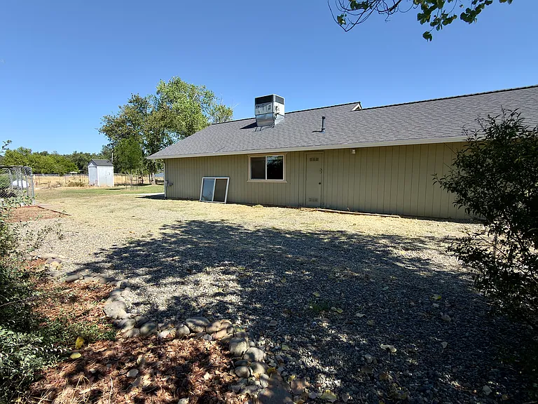 side yard with seating area and RV hookup