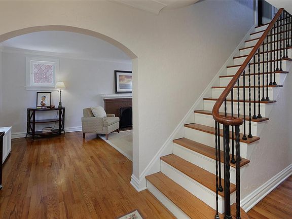 A welcoming center entry foyer opens to the living and dining room.