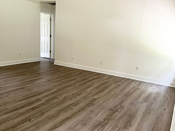 Living room (POV from the kitchen toward the hall)