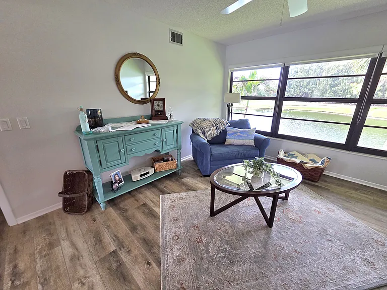 Enjoy stunning lake and golf course views from the living area & bedroom!
