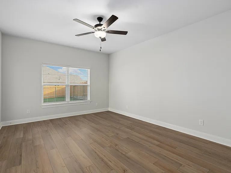 Exceptional master bedroom with vinyl flooring.