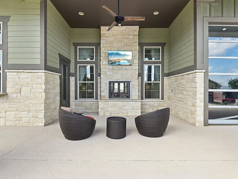 Clubhouse Fireplace Lounge Outside at Overlook at Stone Oak Park Apartments, San Antonio, 78258