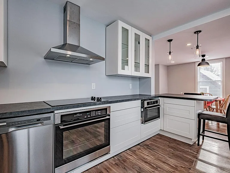New kitchen with cooktop, oven, microwave, and dishwasher