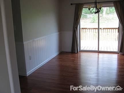 Glass slider leads out to the back porch.