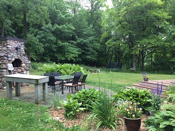 Spacious backyard with outdoor pizza oven