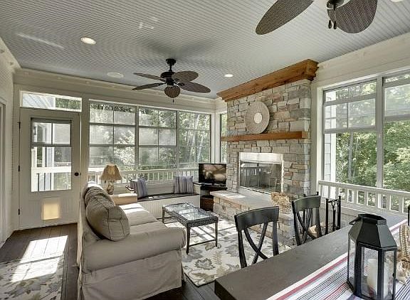 Amazing three season porch with wood burning fireplace