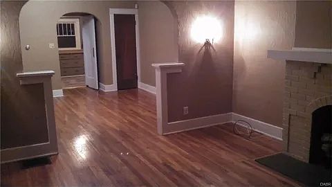 Photo taken from the living room looking into the dining room and back into the kitchen.