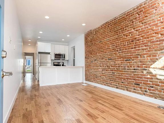 View from living room to kitchen (and backyard beyond)