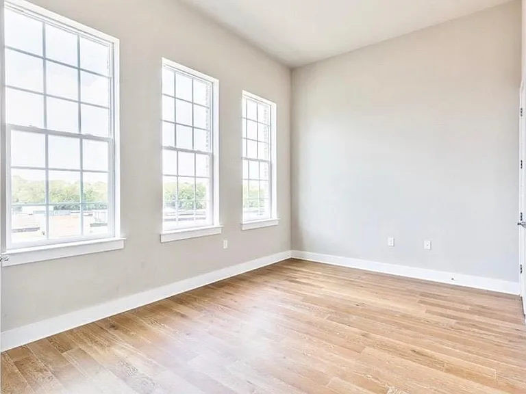 downstairs bedroom or home office has great light and big windows!