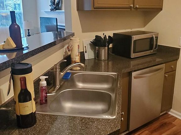 Fully stocked kitchen with Keurig, pots & pans, dishes / glassware / flatware, microwave, garbage disposal, fridge, dishwasher, electric stove & oven! Lots of extras too!!