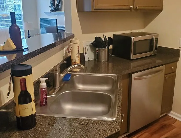 Fully stocked kitchen with Keurig, pots & pans, dishes / glassware / flatware, microwave, garbage disposal, fridge, dishwasher, electric stove & oven! Lots of extras too!!